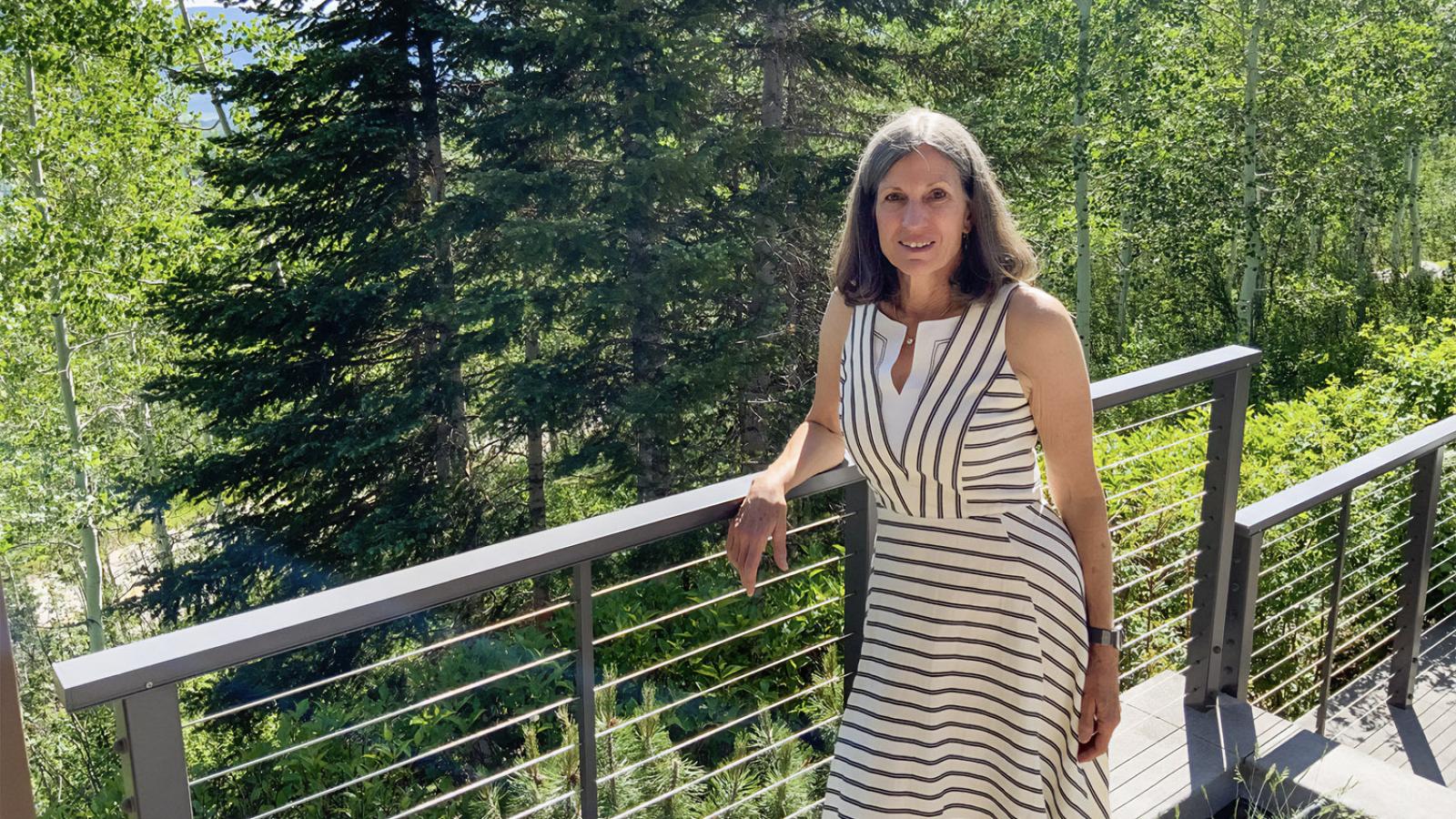 Janet Benton standing outside with trees in the background