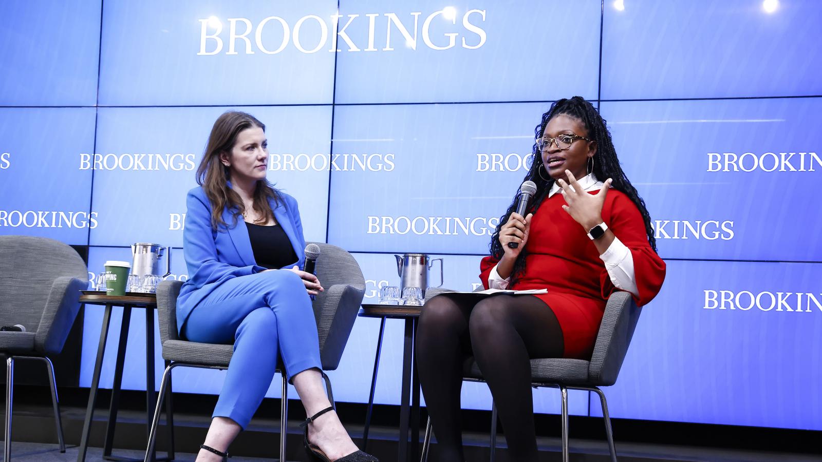 Chinasa Okolo on stage giving a talk to an audience