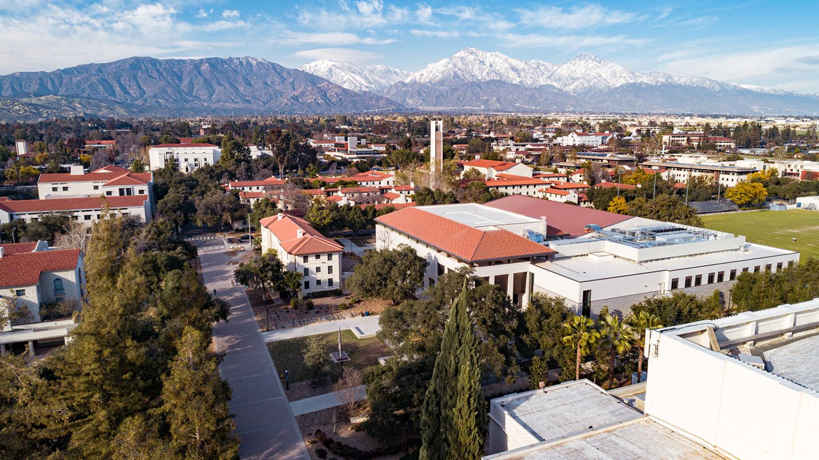 Drone shot of Pomona College with mountains in the background