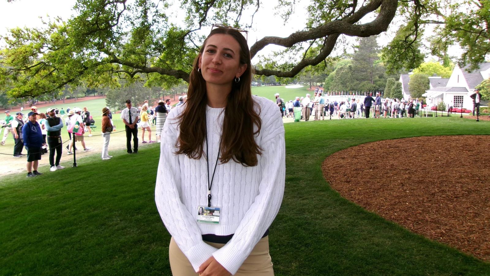 Gabby Herzig smiles on the golf course.