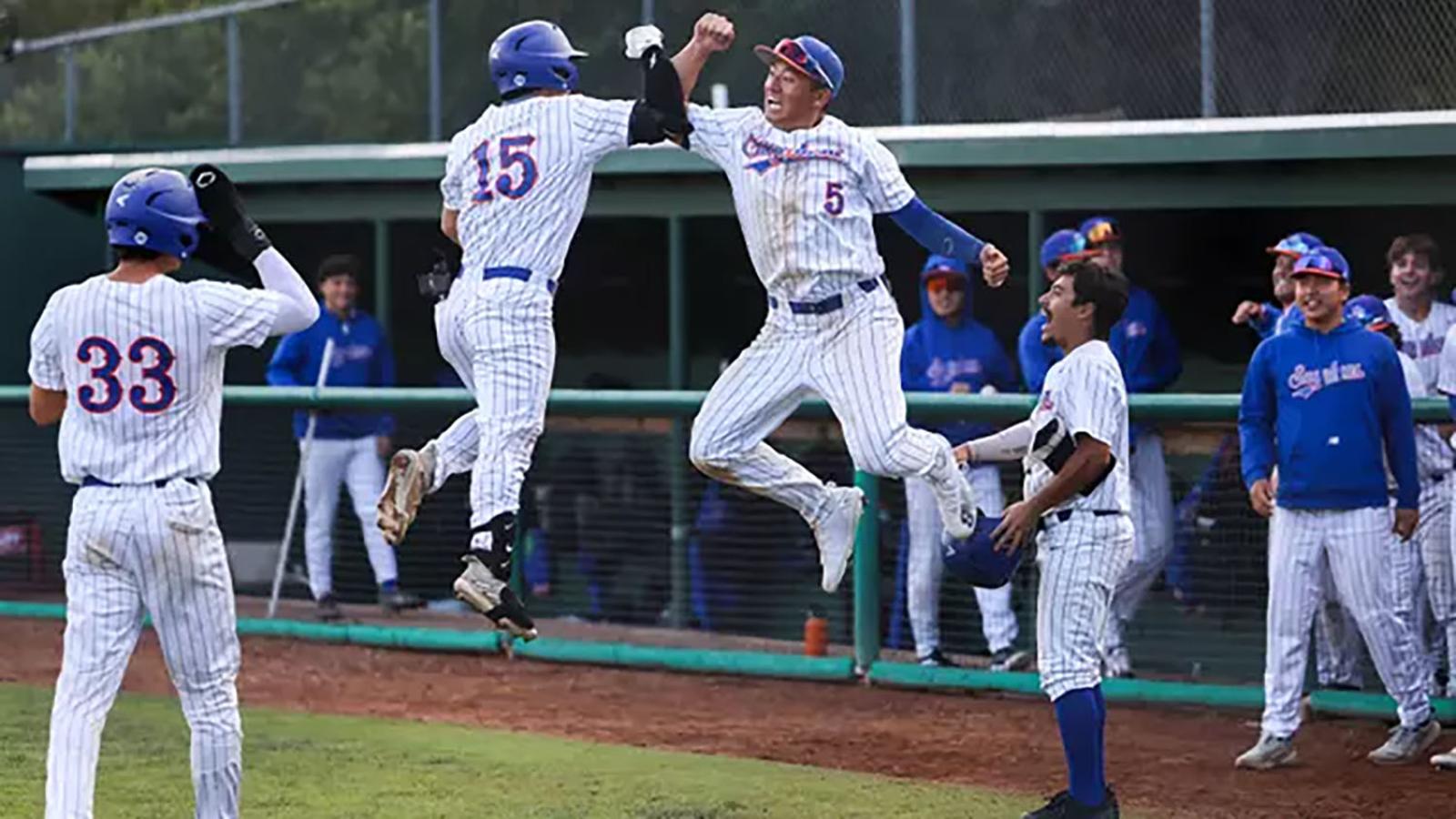Pomona Pitzer baseball players jump in the air as they celebrate two wins
