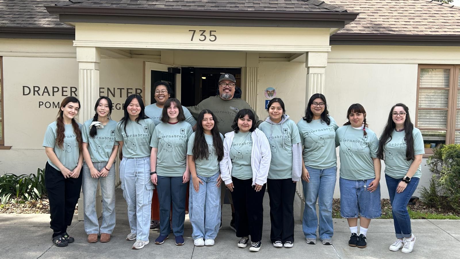 Students take a picture in front of Draper Center