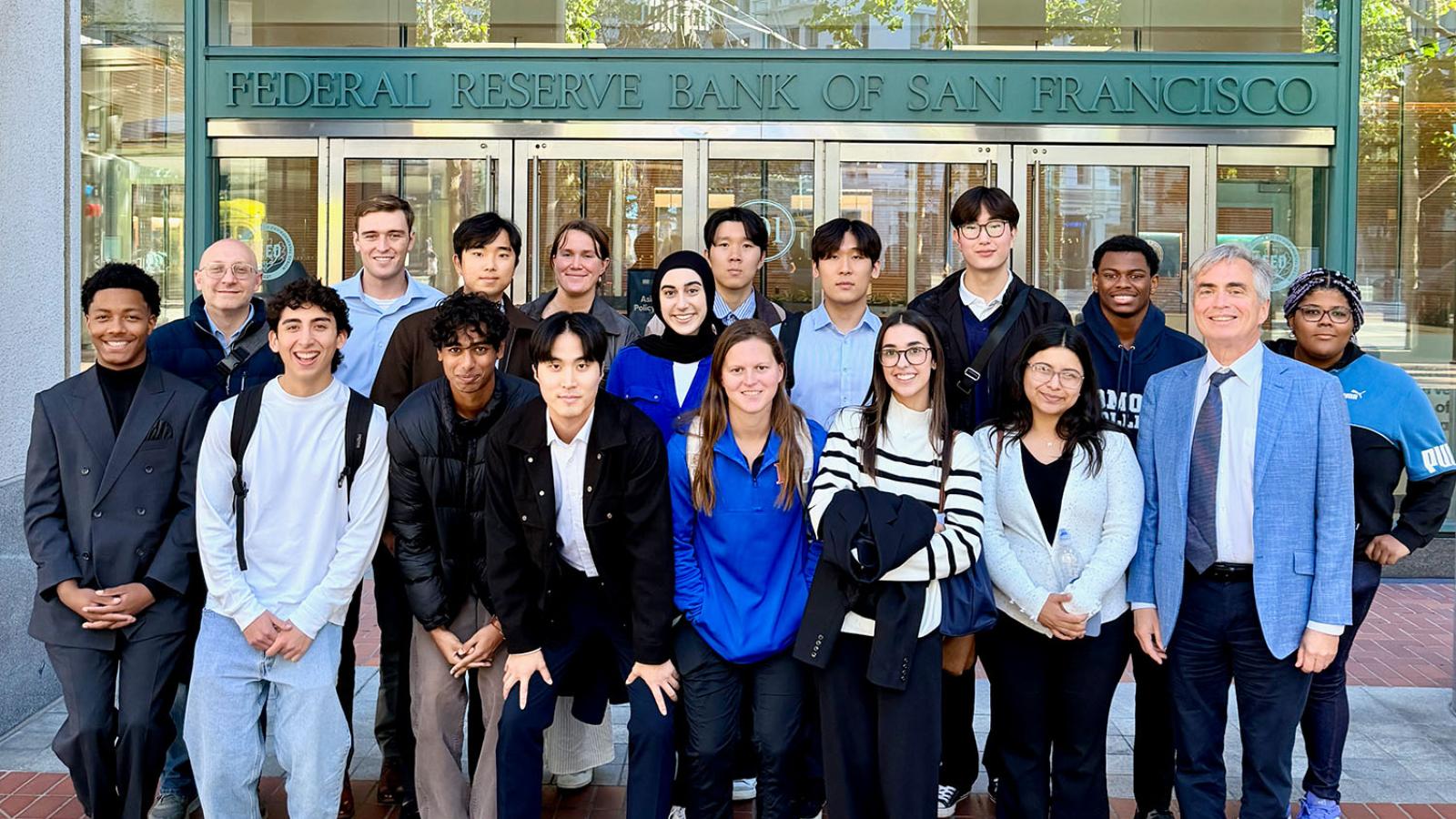 Economics class in front of the San Francisco Fed sign
