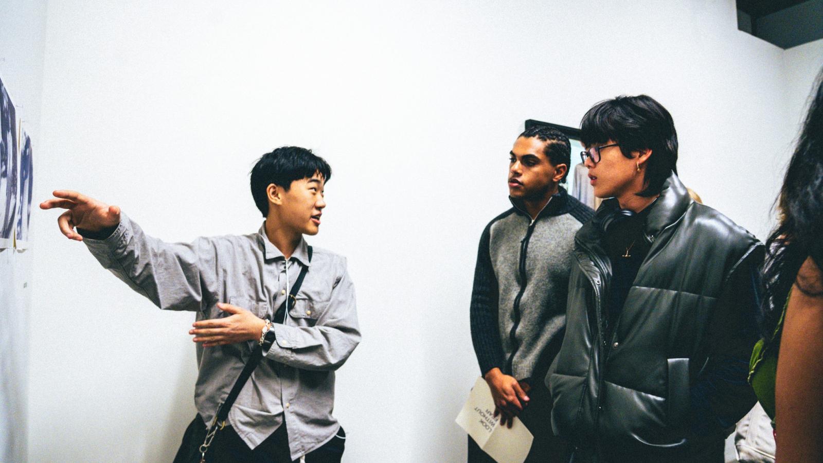 Three students in an art gallery