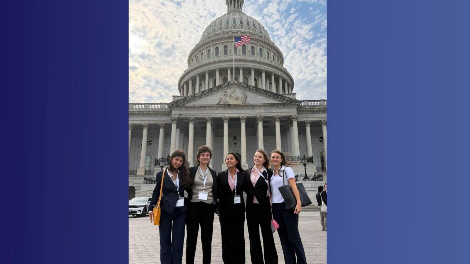 Five students stand in front of U.S. Capitol