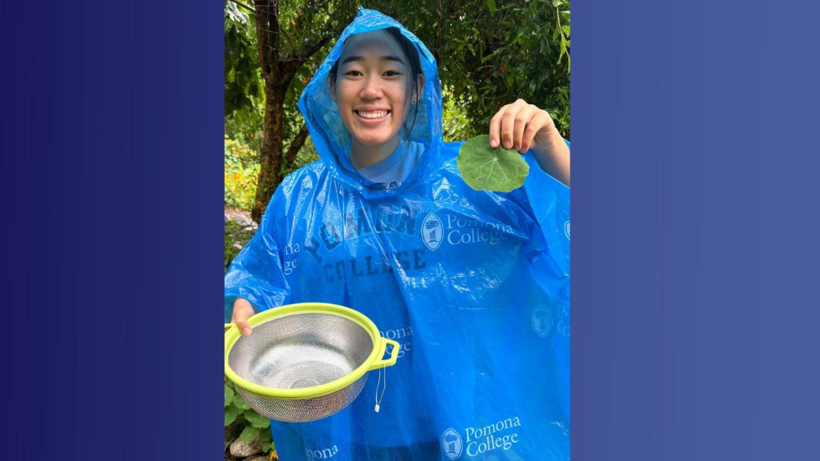 A student holds a leaf