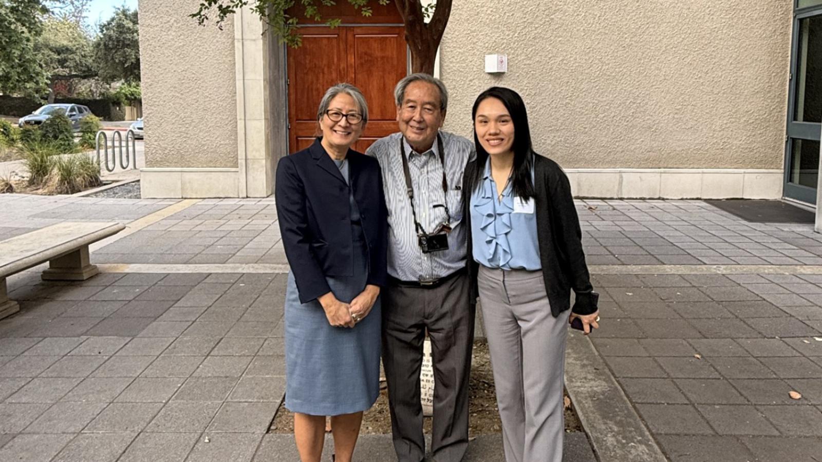 Pomona conference participants Yamashita, Hsu and Hongdeng outside of Hahn Hall