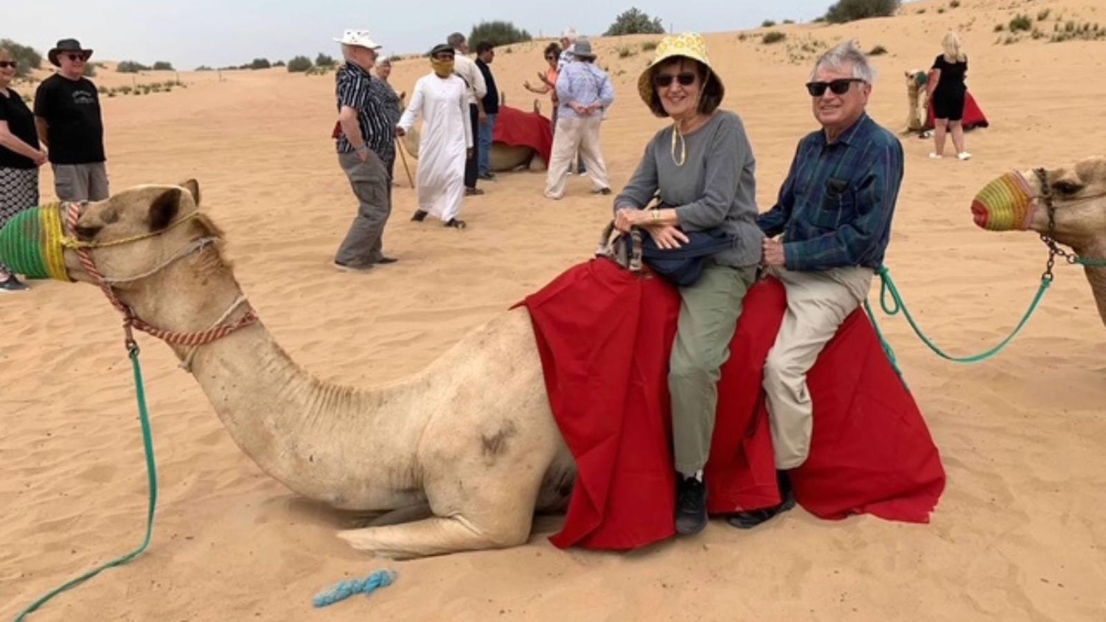 ed and leslie derkum on a camel in india