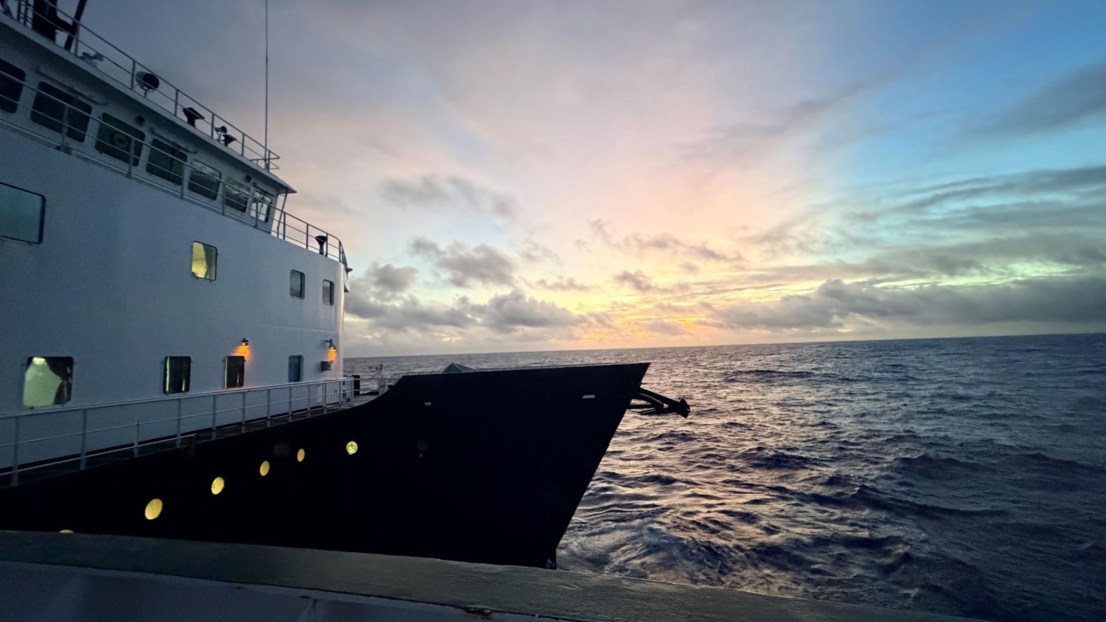 Sunset over he ocean, view from a ship deck