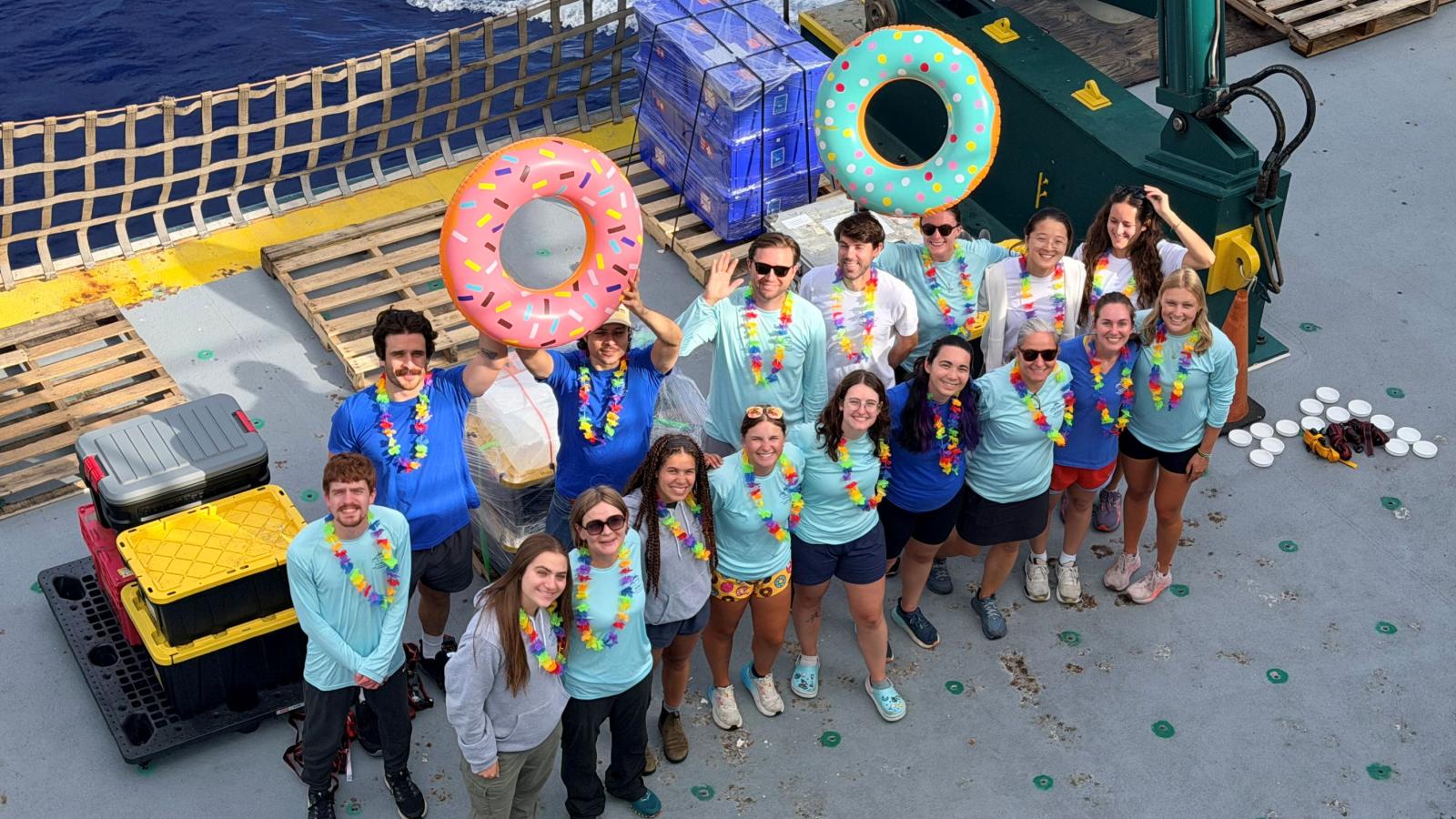 Group photo with all members of research teams gathered on deck