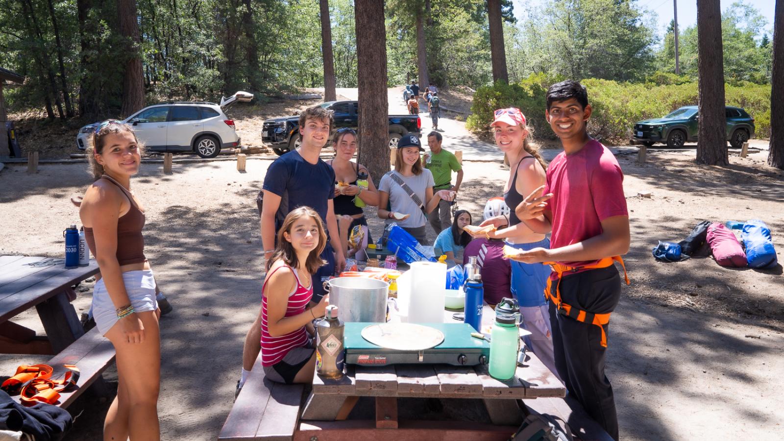 A group of people at a picnic table