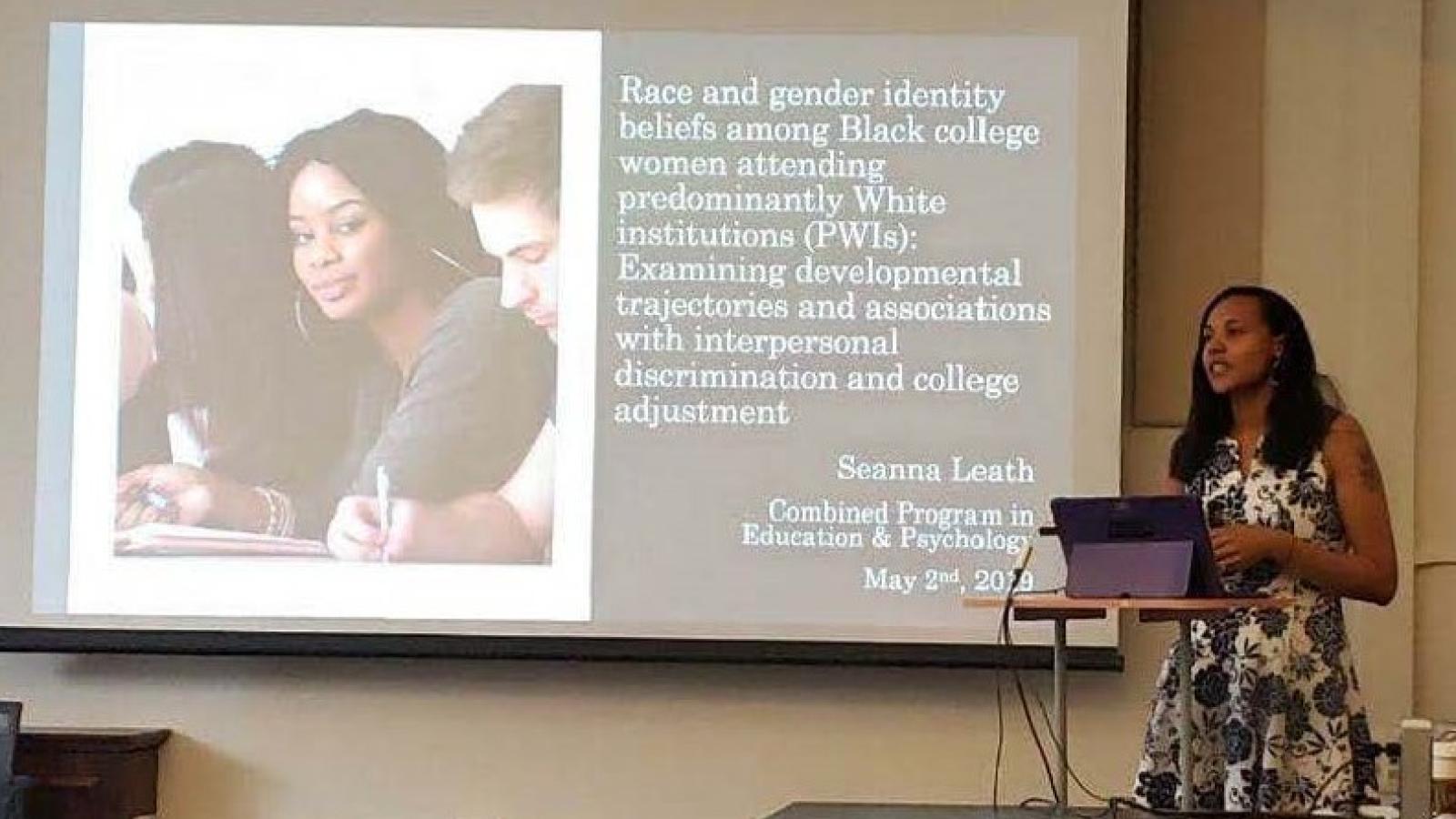 woman by podium giving lecture