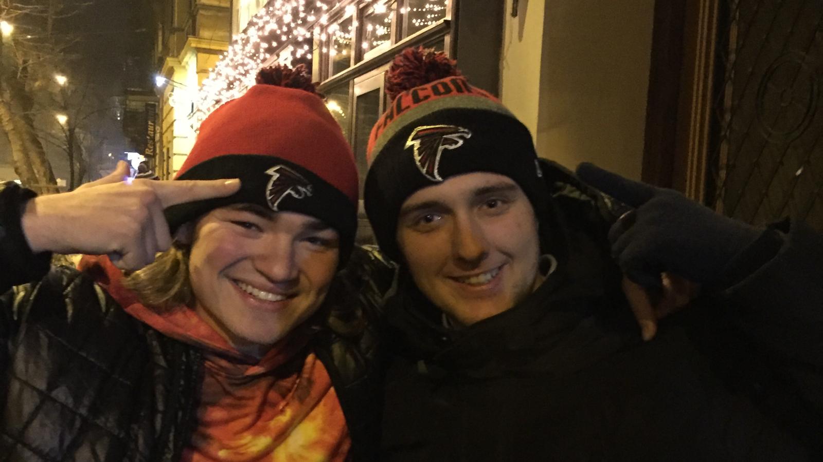 Cai (left) and Hungarian friend connect over shared love of Falcons and Hungarian language.