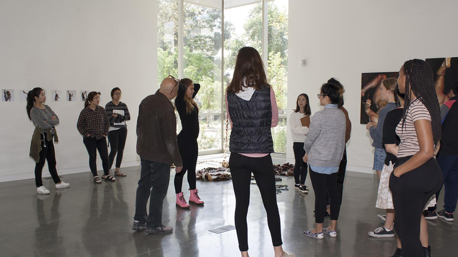 Junior Sara Arthur-Paratley discussing her artwork