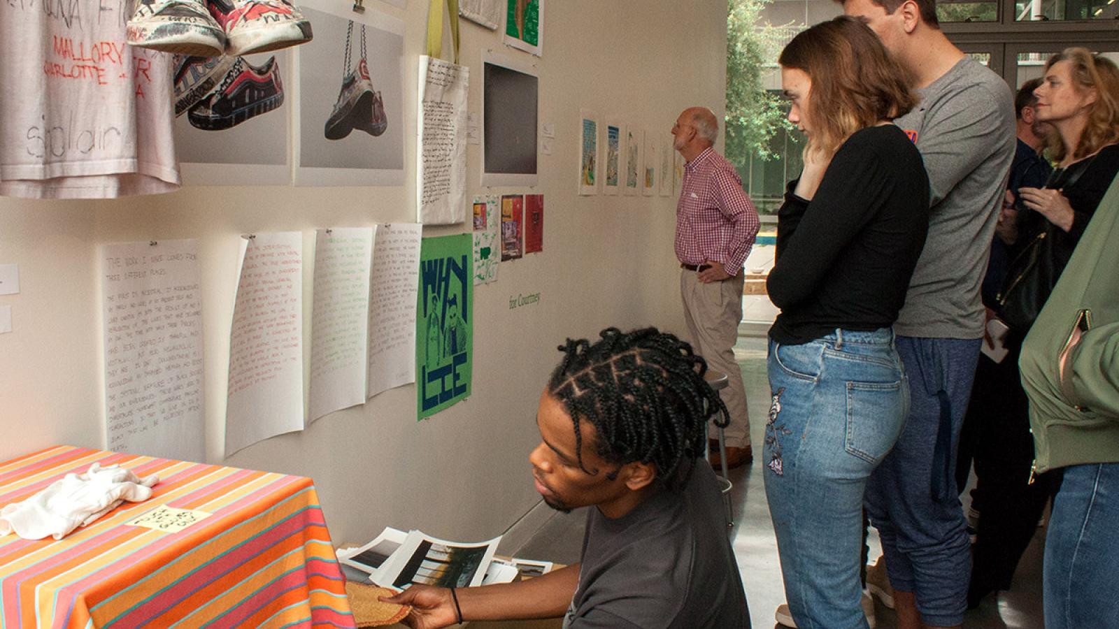 Viewers observing 50 DAYS Exhibition