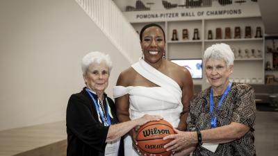 Former women's basketball coaches Nancy Breitenstein, left, and Nettie Morrison, right, with Athletics Director Miriam Merrill