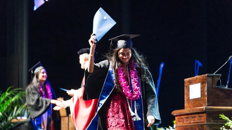 Commencement 2024 students receiving their degrees