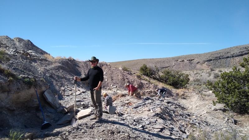 Bob Gaines stands in a rocky field