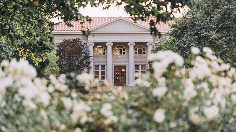 Carnegie Building through roses