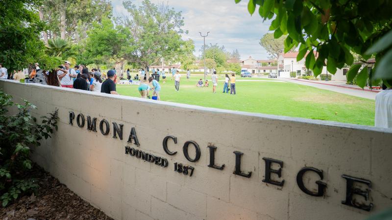 students gathered at walker wall, with the Pomona College Founded 1887 side showing