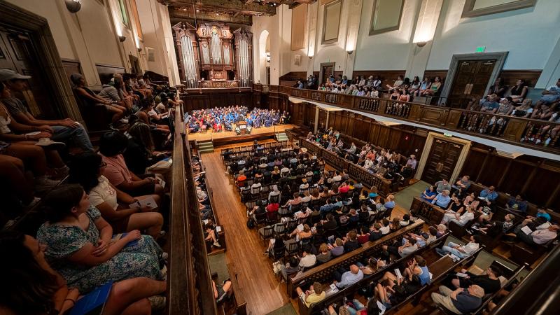 convocation with people sitting inside little bridges