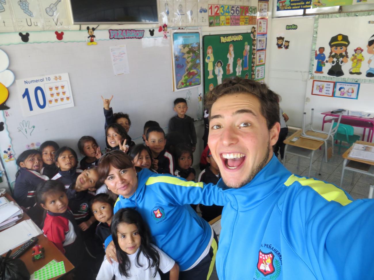 Danny DeBare with a classroom of children
