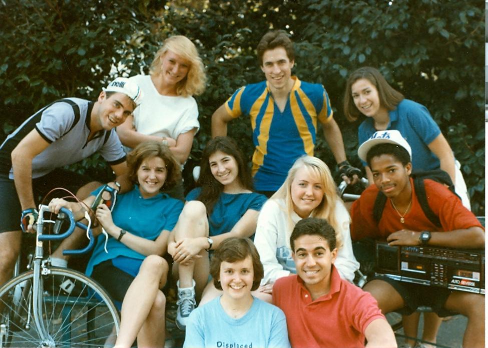 The cast from Campus Cabaret's 1980s production of "Key Exchange," with Callander on bike.