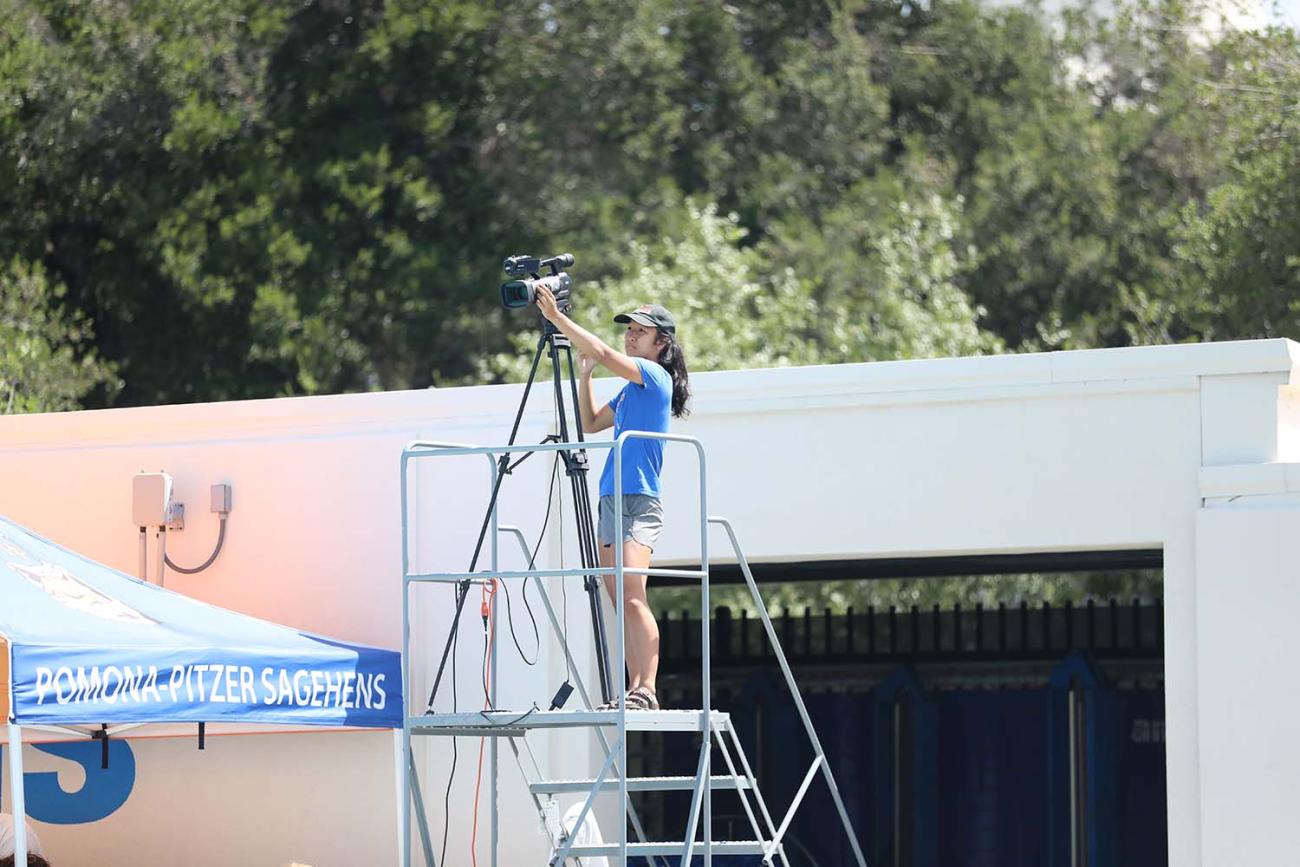 Taylor Venenciano works the camera at a women's water polo game