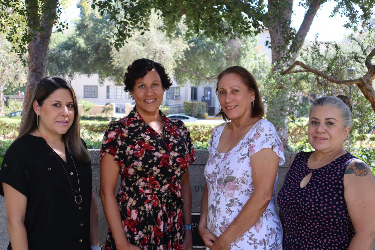 Arianna Carrillo, Gina Green, Socorro Chavez and Josi Munoz-Rubalcava outside with trees in background