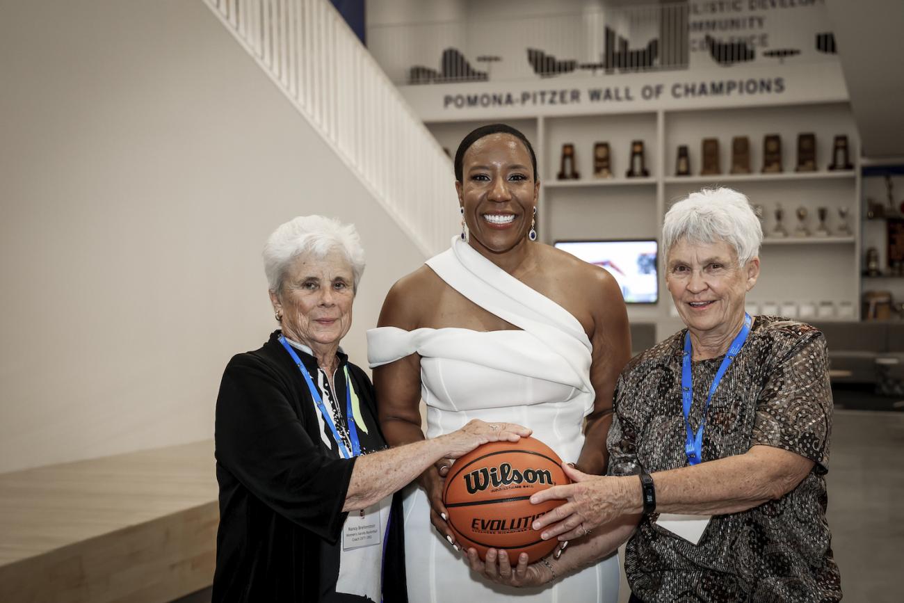 Former women's basketball coaches Nancy Breitenstein, left, and Nettie Morrison, right, with Athletics Director Miriam Merrill