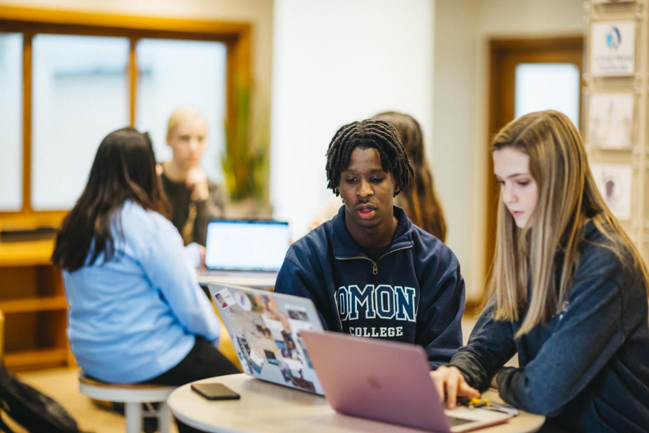 students working together on their computers