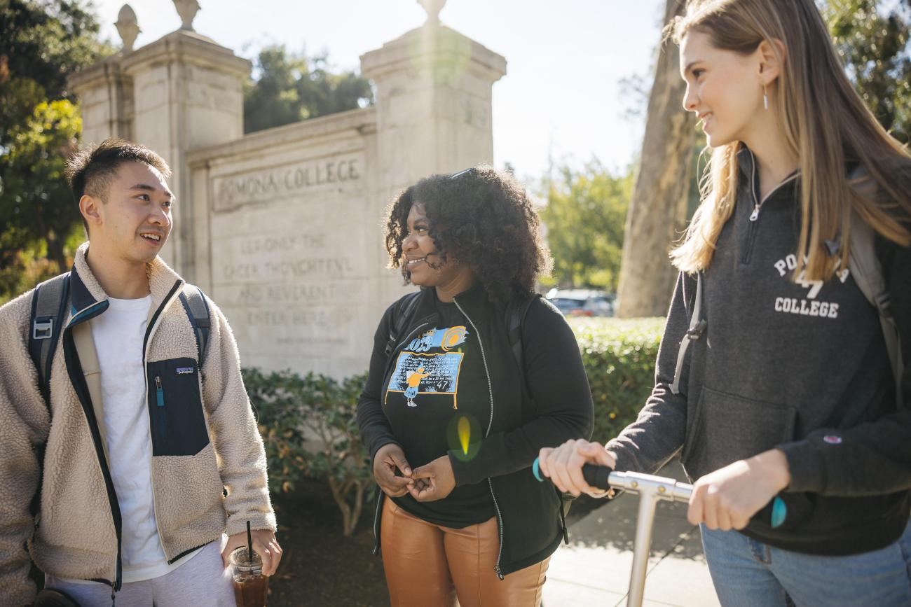 students walking by the Pomona gates 