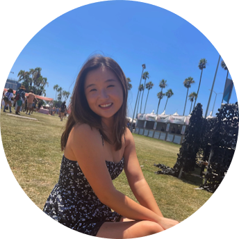 A student sitting on the grass