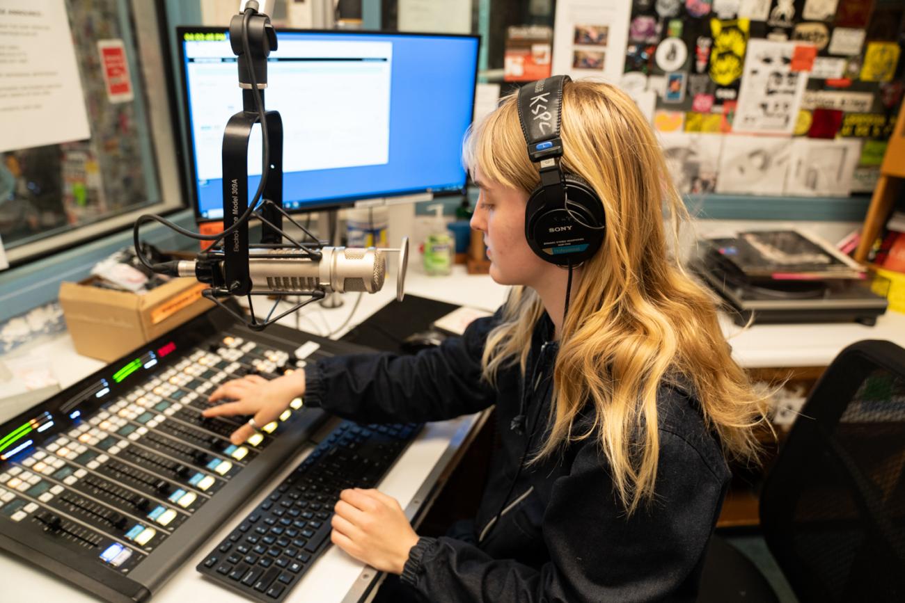 Lottie Malkmus '27 at a radio soundboard