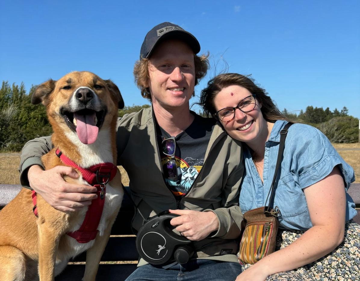 Andrew Law with a woman and a dog