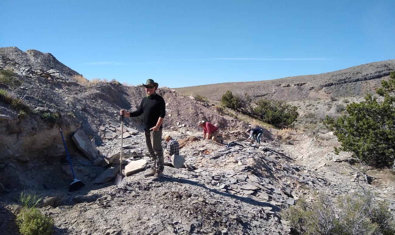 Bob Gaines stands in a field of dirt and rocks