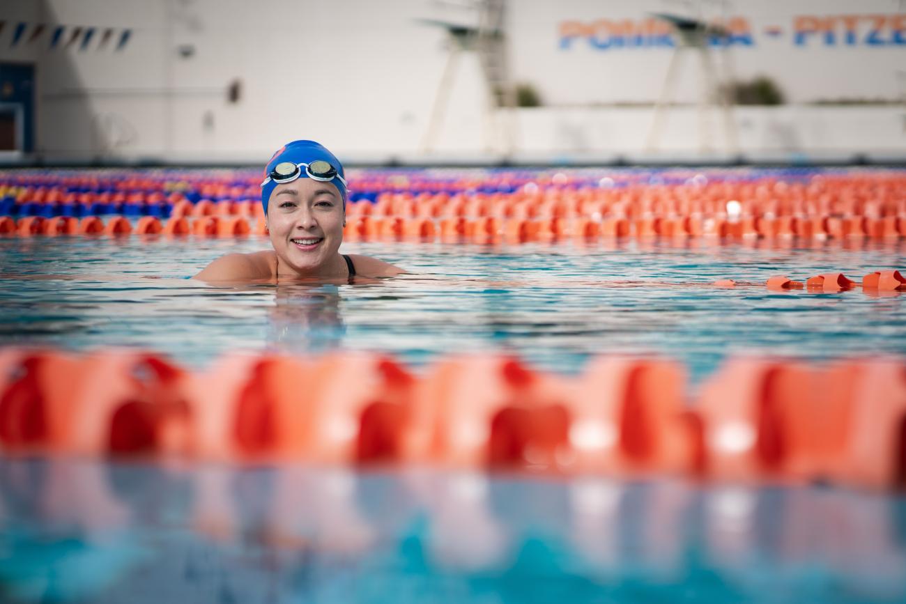 Emmie Appl floats and smiles in a pool
