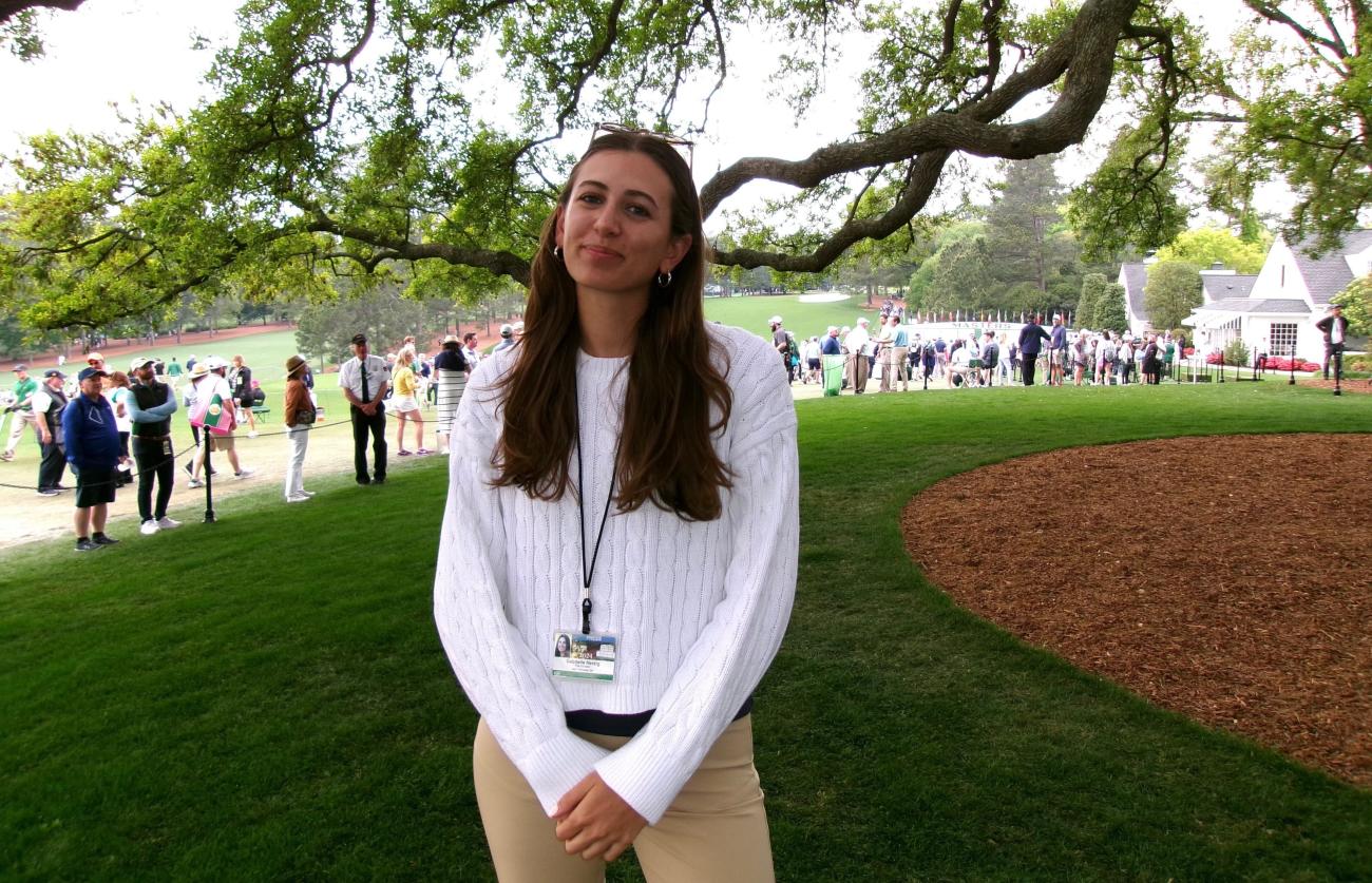 Gabby Herzig smiles on the golf course.