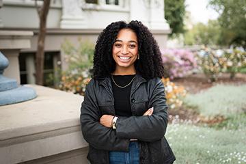 Nadiya Muhammad '25 stands outside Carnegie Hall on the Pomona campus.