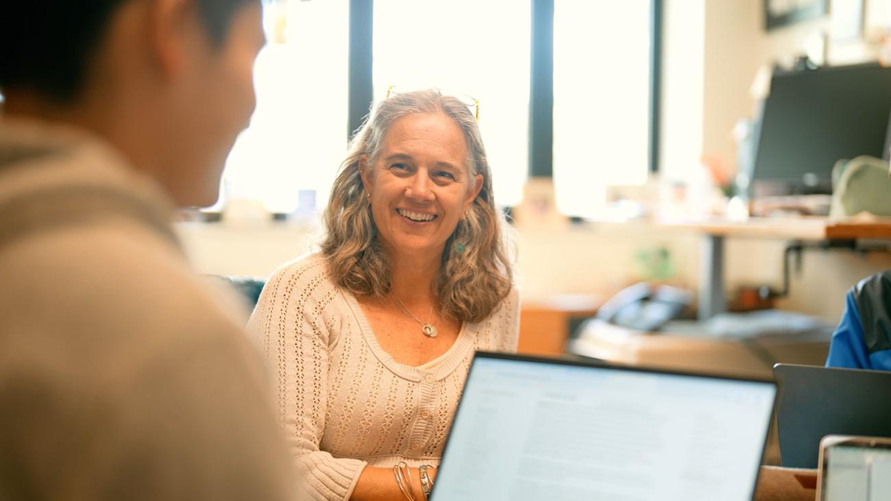 Prof. Jo Hardin in a classroom setting with a student.