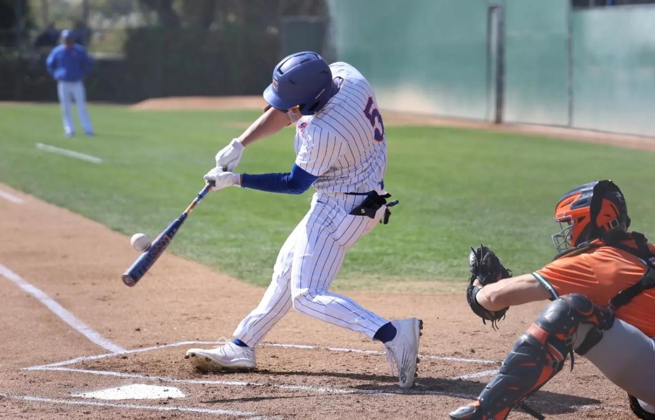 JC Ng swings a bat