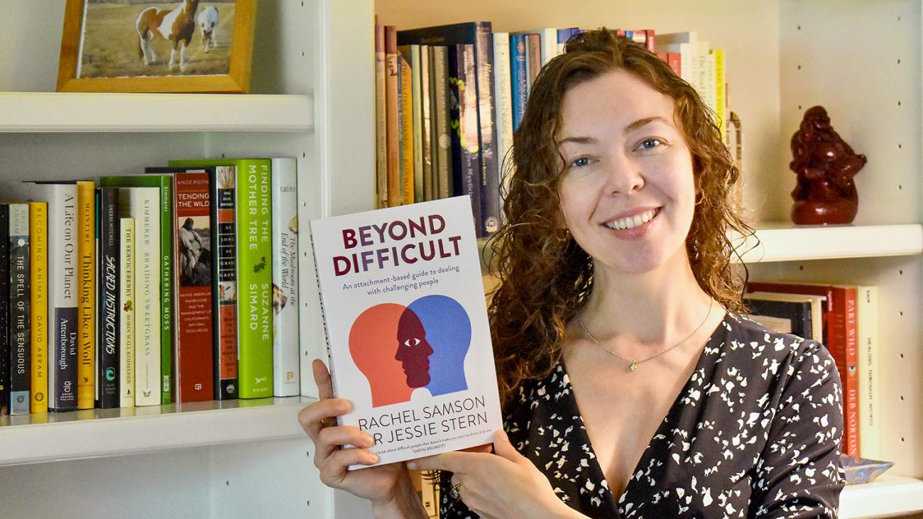 Prof. Jessica Stern holding her book Beyond Difficult