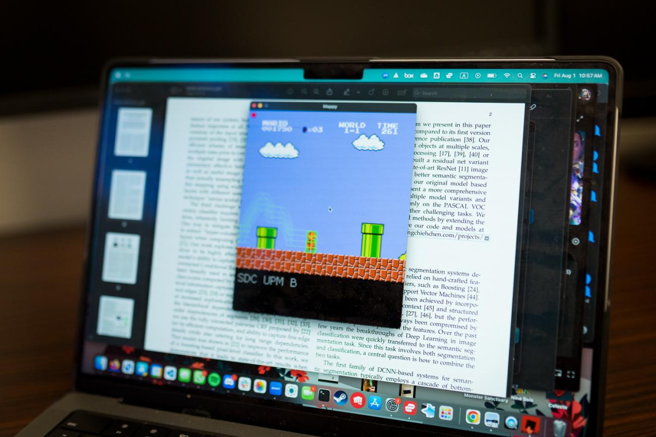 A screen shows Super Mario World video game