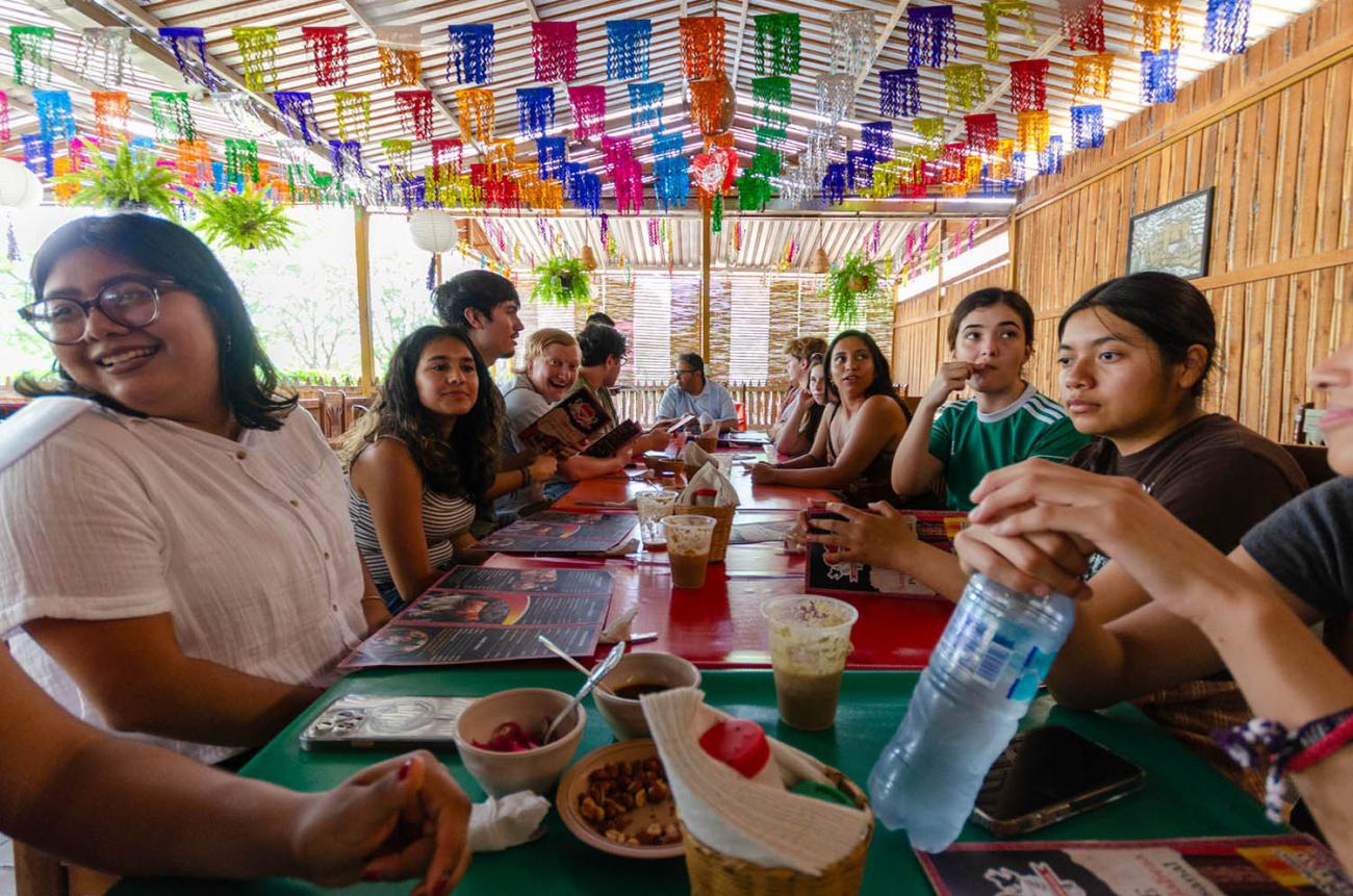 Students share a meal.