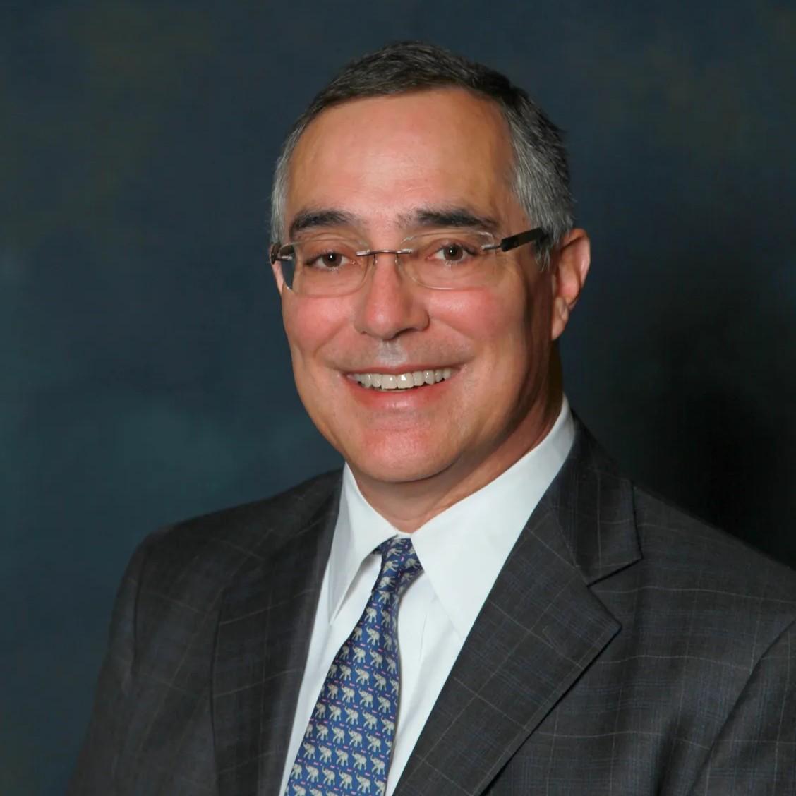 Headshot photo of Chris Ponce, former vice president for advancement at Pomona.