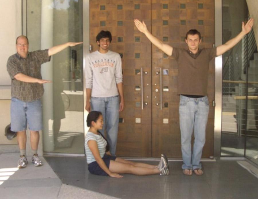 Prof. Karl Johnson and students use their bodies to spell out "fly" in recognition of their lab work with fruit flies.