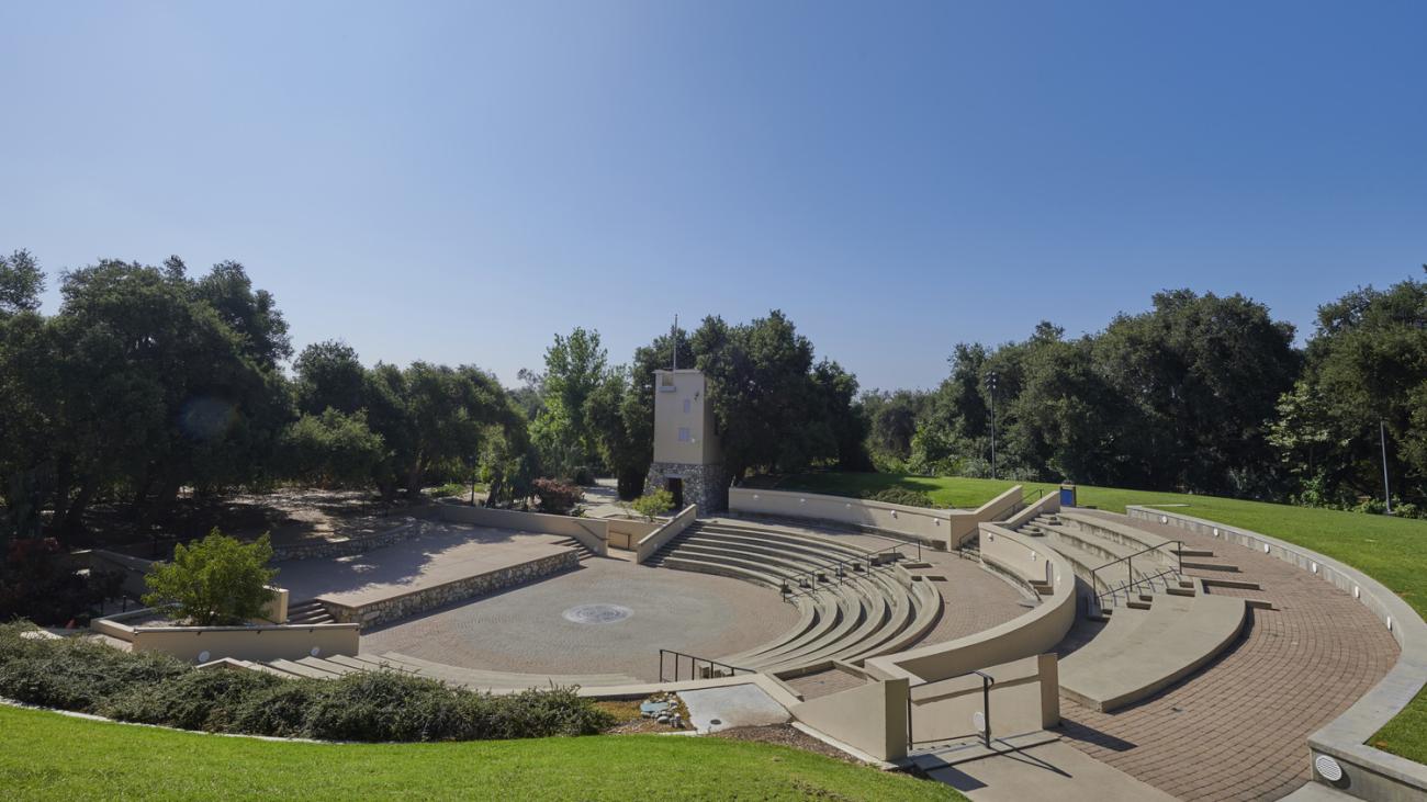 Photo of Sontag Greek Theatre with sunshine and greenery.