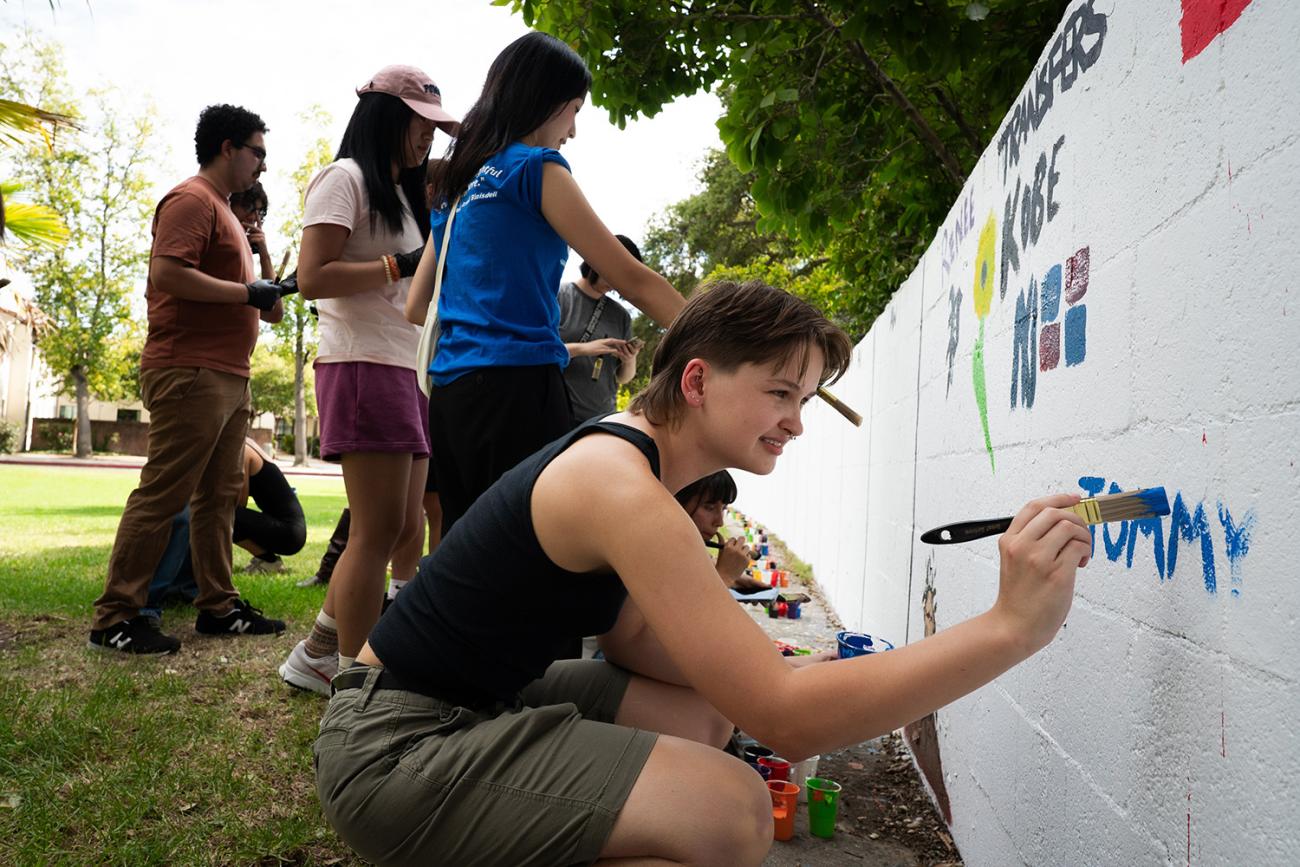 Students painting Walker Wall