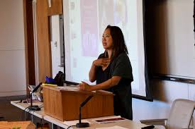 Elena Shih speaking in a classroom