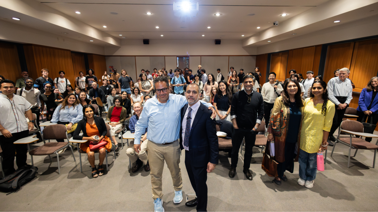 Professor Lozano and Asim Ijaz Khwaja pose with the lecture audience in Hahn Hall